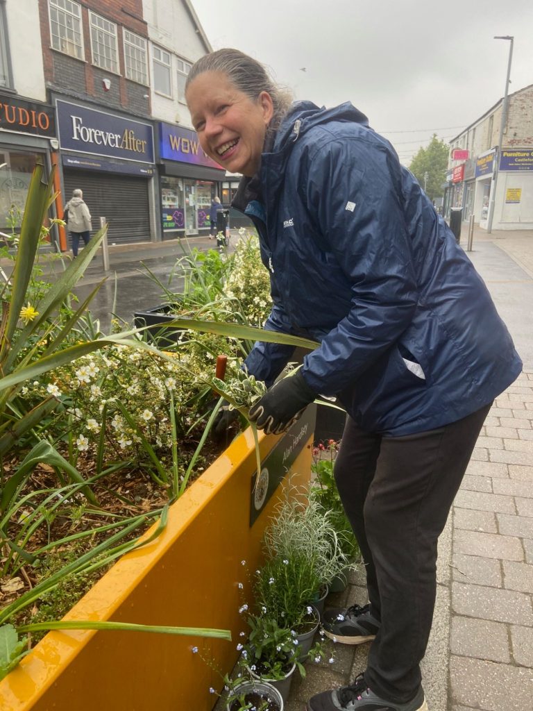 Blooming marvellous
on this damp May Day the
Friends of Castleford library planting to brighten up the flower tubs outside the library.